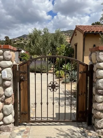 Iron and wood gate repair in Fresno